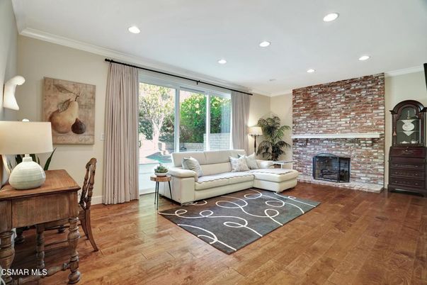 Dining room, Fireplace, Interior, Living room, Recessed Lighting, Stone Walls, Wood Texture Flooring