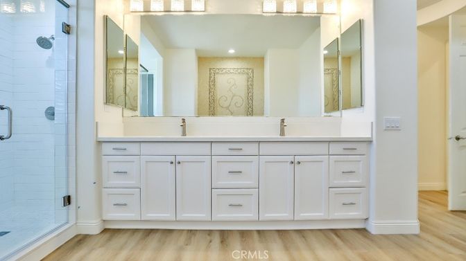 Bathroom, Dual Sink Vanities, Glass Shower, Interior, Recessed Lighting, Wood Texture Flooring