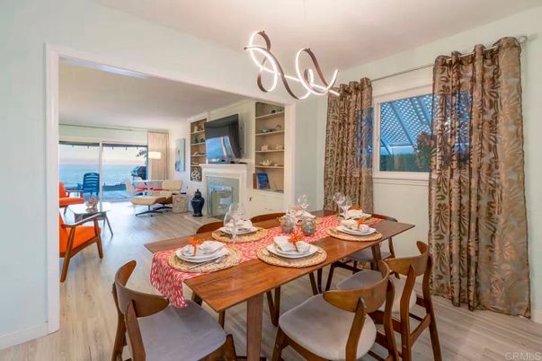 Dining room, Fireplace, Interior, Living room, Pendant Lights, Water, Wood Texture Flooring