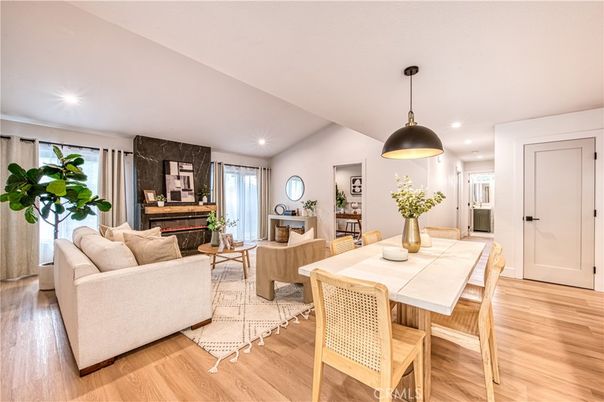 Dining room, Fireplace, Interior, Living room, Pendant Lights, Recessed Lighting, Wood Texture Flooring