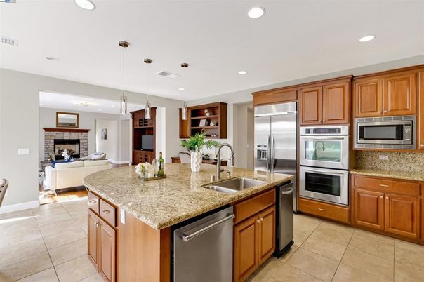 Fireplace, Interior, Kitchen, Living room, Pendant Lights, Recessed Lighting, Stainless Steel Appliances