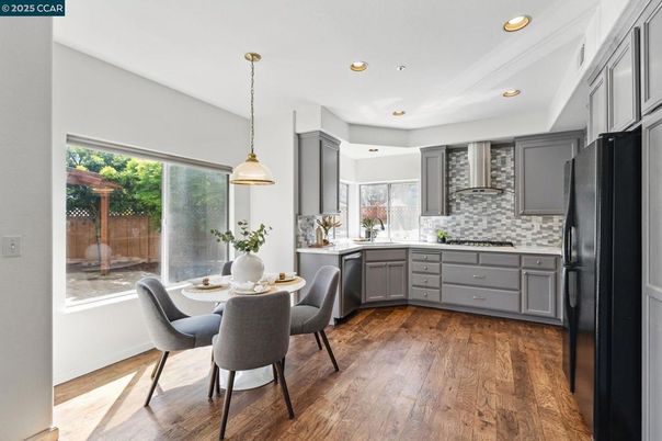 Dining room, Interior, Kitchen, Pendant Lights, Recessed Lighting, Stainless Steel Appliances, Wood Texture Flooring