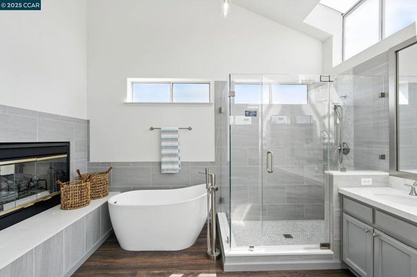 Bathroom, Fireplace, Free Standing Baths, Glass Shower, Interior, Wood Texture Flooring