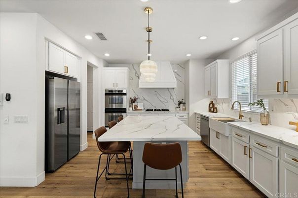 Interior, Kitchen, Marble Walls, Pendant Lights, Recessed Lighting, Stainless Steel Appliances, Wood Texture Flooring