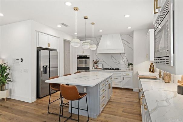 Interior, Kitchen, Marble Walls, Pendant Lights, Recessed Lighting, Stainless Steel Appliances, Wood Texture Flooring