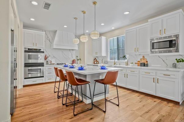 Interior, Kitchen, Marble Walls, Pendant Lights, Recessed Lighting, Stainless Steel Appliances, Wood Texture Flooring
