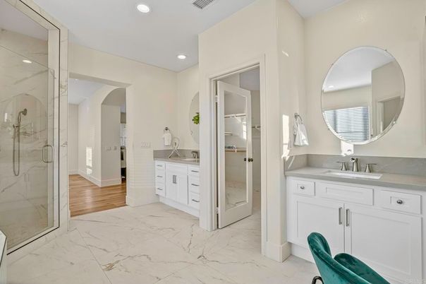 Bathroom, Dual Sink Vanities, Glass Shower, Interior, Marble, Marble Walls, Recessed Lighting, Wood Texture Flooring
