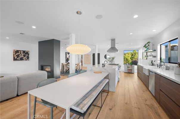 Dining room, Fireplace, Interior, Kitchen, Living room, Pendant Lights, Recessed Lighting, Stainless Steel Appliances, Wood Texture Flooring