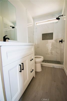 Bathroom, Glass Shower, Interior, Marble Walls, Wood Texture Flooring