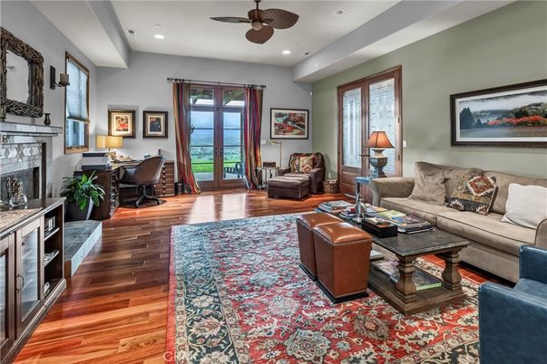 Fireplace, Home Office, Interior, Living room, Recessed Lighting, Water, Wood Texture Flooring