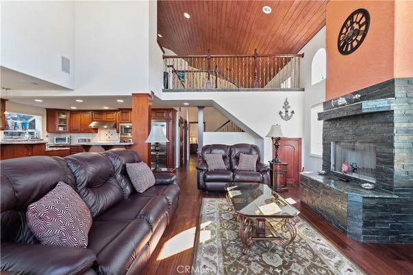 Fireplace, Interior, Kitchen, Living room, Recessed Lighting, Stainless Steel Appliances, Wooden Ceilings, Wood Texture Flooring