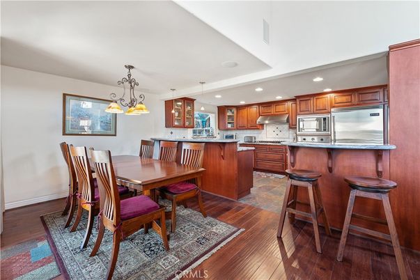 Dining room, Interior, Kitchen, Pendant Lights, Recessed Lighting, Stainless Steel Appliances, Wood Texture Flooring