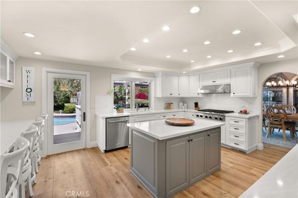 Chandelier, Dining room, Interior, Kitchen, Recessed Lighting, Stainless Steel Appliances, Wood Texture Flooring