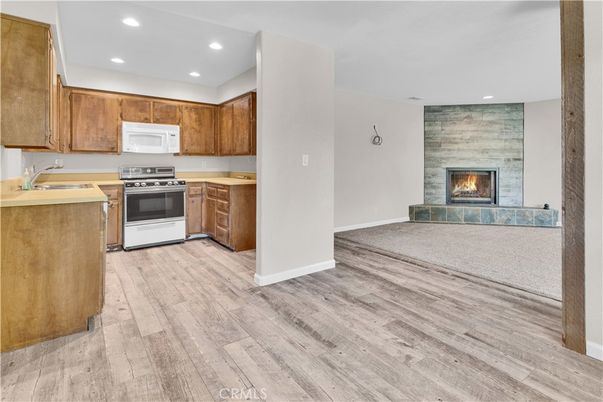 Fireplace, Interior, Kitchen, Recessed Lighting, Stone Walls, Wood Texture Flooring