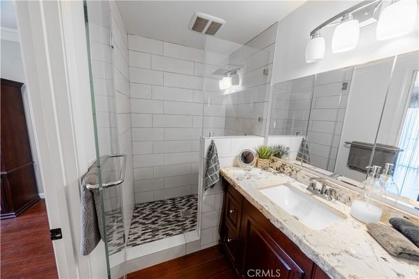 Bathroom, Dual Sink Vanities, Glass Shower, Interior, Wood Texture Flooring