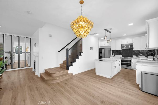 Chandelier, Interior, Kitchen, Pendant Lights, Recessed Lighting, Stainless Steel Appliances, Wood Texture Flooring