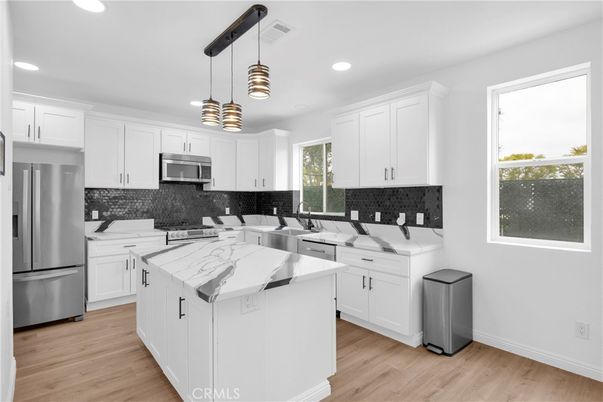 Interior, Kitchen, Pendant Lights, Recessed Lighting, Stainless Steel Appliances, Wood Texture Flooring