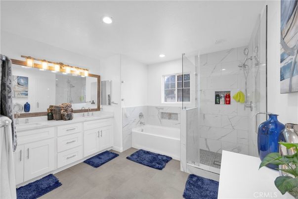 Bathroom, Dual Sink Vanities, Glass Shower, Interior, Marble Walls, Recessed Lighting
