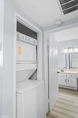 Bathroom, Interior, Utility Closets, Washer, Wood Texture Flooring