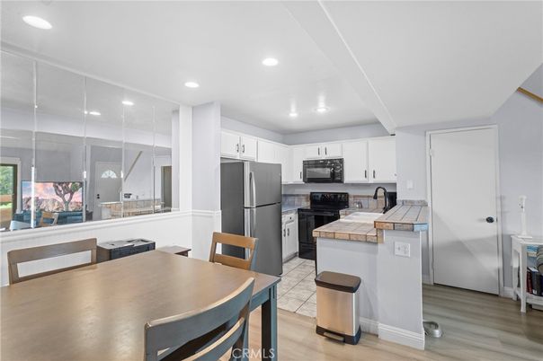 Dining room, Interior, Kitchen, Recessed Lighting, Tile Countertops, Wood Texture Flooring