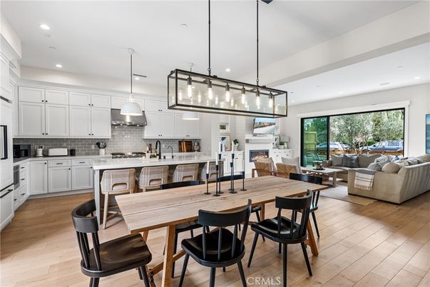 Dining room, Fireplace, Interior, Kitchen, Living room, Pendant Lights, Recessed Lighting, Stainless Steel Appliances, Wood Texture Flooring