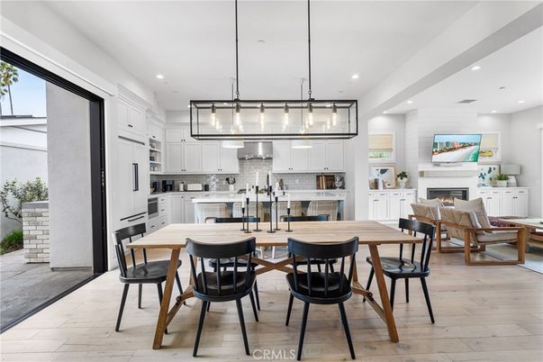 Dining room, Fireplace, Interior, Kitchen, Pendant Lights, Recessed Lighting, Stainless Steel Appliances, Wood Texture Flooring