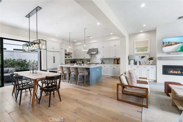 Dining room, Fireplace, Interior, Kitchen, Pendant Lights, Recessed Lighting, Stainless Steel Appliances, Wood Texture Flooring