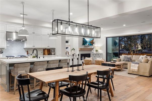 Dining room, Fireplace, Interior, Kitchen, Living room, Pendant Lights, Recessed Lighting, Stainless Steel Appliances, Wood Texture Flooring