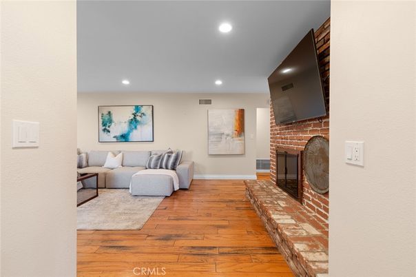 Fireplace, Interior, Living room, Recessed Lighting, Wood Texture Flooring