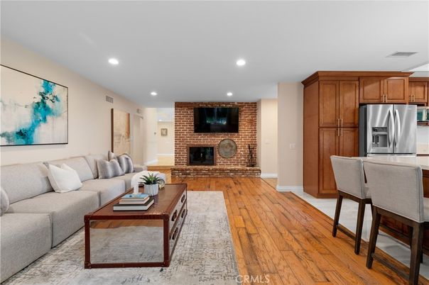 Fireplace, Interior, Kitchen, Living room, Recessed Lighting, Stainless Steel Appliances, Stone Walls, Wood Texture Flooring