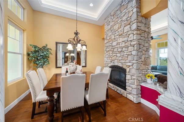 Chandelier, Dining room, Fireplace, Interior, Recessed Lighting, Stone Walls, Wood Texture Flooring