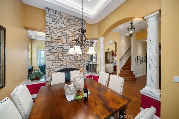 Chandelier, Dining room, Fireplace, Interior, Pendant Lights, Stone Walls, Wood Texture Flooring