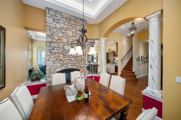 Chandelier, Dining room, Fireplace, Interior, Pendant Lights, Stone Walls, Wood Texture Flooring