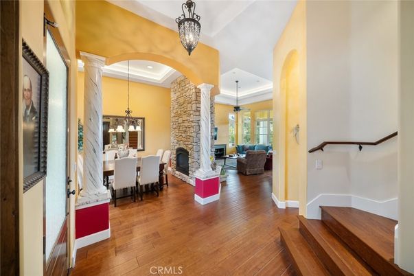 Dining room, Fireplace, Interior, Living room, Pendant Lights, Recessed Lighting, Wood Texture Flooring