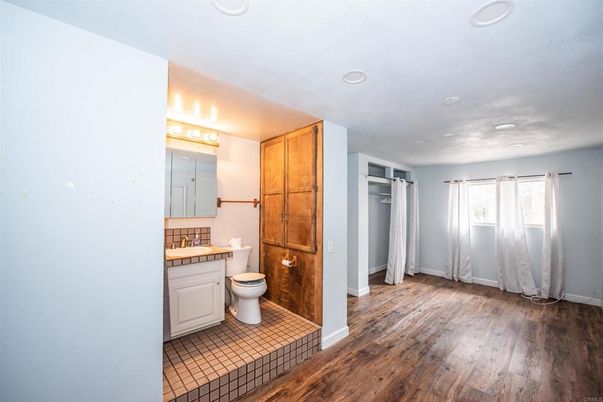 Bathroom, Interior, Recessed Lighting, Tile Countertops, Wood Texture Flooring