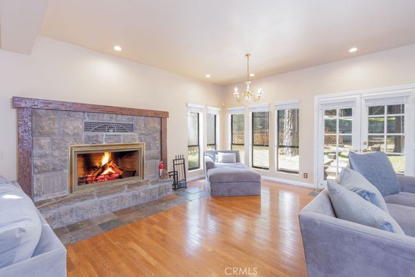Chandelier, Fireplace, Interior, Living room, Recessed Lighting, Wood Texture Flooring