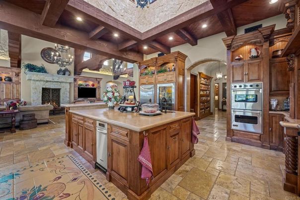 Chandelier, Fireplace, Interior, Kitchen, Living room, Pendant Lights, Recessed Lighting, Stainless Steel Appliances, Wooden Beams, Wooden Ceilings