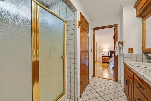 Bathroom, Bedroom, Glass Shower, Interior, Tile Countertops, Wood Texture Flooring