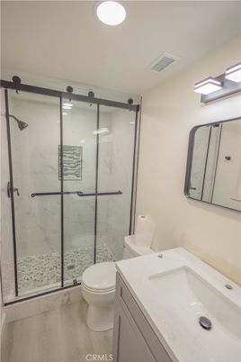 Bathroom, Glass Shower, Interior, Marble Walls, Recessed Lighting, Wood Texture Flooring