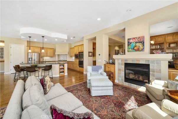Fireplace, Interior, Kitchen, Living room, Pendant Lights, Recessed Lighting, Stainless Steel Appliances, Wood Texture Flooring