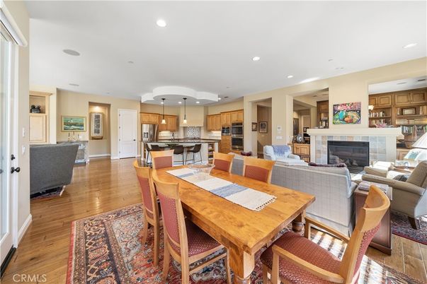 Dining room, Fireplace, Interior, Kitchen, Living room, Pendant Lights, Recessed Lighting, Stainless Steel Appliances, Wood Texture Flooring