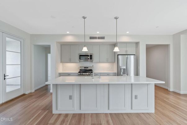 Interior, Kitchen, Pendant Lights, Recessed Lighting, Stainless Steel Appliances, Wood Texture Flooring
