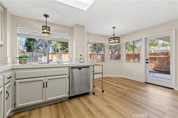 Interior, Kitchen, Pendant Lights, Tile Countertops, Wood Texture Flooring