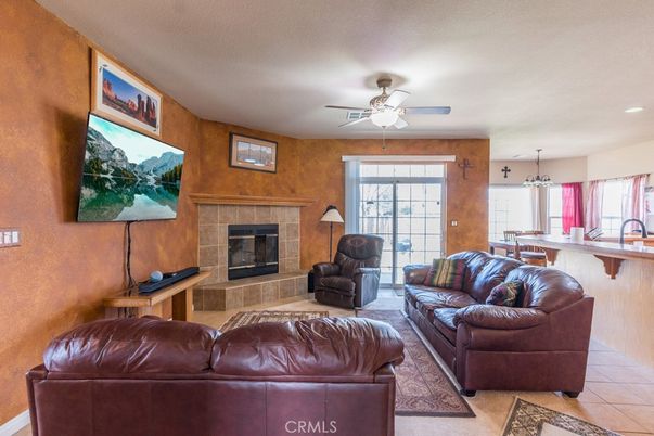Chandelier, Dining room, Fireplace, Interior, Living room, Pendant Lights, Recessed Lighting, Wooden Walls