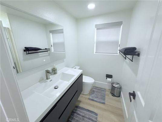 Bathroom, Dual Sink Vanities, Interior, Recessed Lighting, Wood Texture Flooring