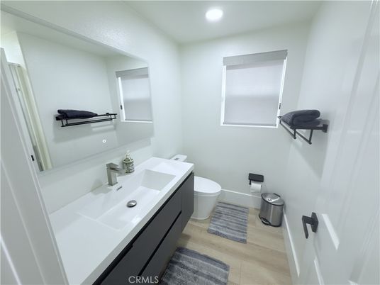 Bathroom, Dual Sink Vanities, Interior, Recessed Lighting, Wood Texture Flooring