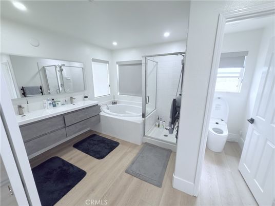 Bathroom, Dual Sink Vanities, Glass Shower, Interior, Recessed Lighting, Wood Texture Flooring
