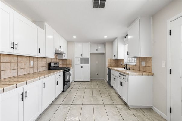 Interior, Kitchen, Recessed Lighting, Tile Countertops