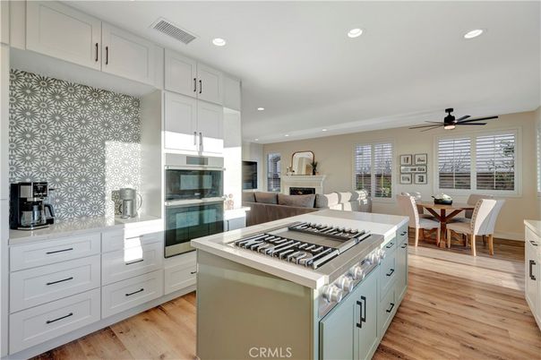 Dining room, Interior, Kitchen, Living room, Recessed Lighting, Stainless Steel Appliances, Wood Texture Flooring
