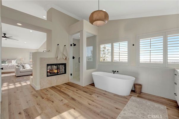 Bathroom, Fireplace, Free Standing Baths, Interior, Pendant Lights, Recessed Lighting, Wood Texture Flooring